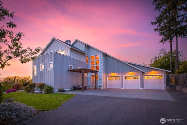884 Saratoga Way, Camano Island, WA 98282 - view of front of home with driveway, a pergola, an attached garage, and a chimney