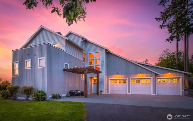 884 Saratoga Way, Camano Island, WA 98282 - view of front facade with a pergola, driveway, an attached garage, and a lawn