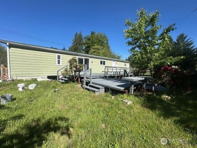 3722 Delphi Rd SW, Olympia, WA 98572 - rear view of property with a wooden deck and a yard