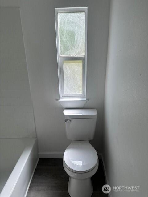 3722 Delphi Rd SW, Olympia, WA 98572 - bathroom featuring baseboards, toilet, a tub to relax in, and wood finished floors