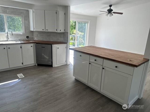 3722 Delphi Rd SW, Olympia, WA 98572 - kitchen with stainless steel dishwasher, butcher block countertops, a sink, and plenty of natural light