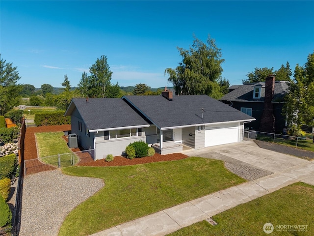 659 NW New York Ave, Chehalis, WA 98532 - view of front facade with central AC, an attached garage, concrete driveway, and a shingled roof