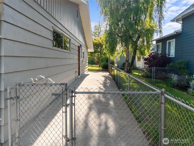 659 NW New York Ave, Chehalis, WA 98532 - view of side of property featuring a gate and board and batten siding