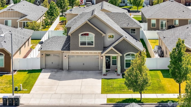 4709 W Fox St, Moses Lake, WA 98837 - view of front of property with concrete driveway, a residential view, an attached garage, and a shingled roof