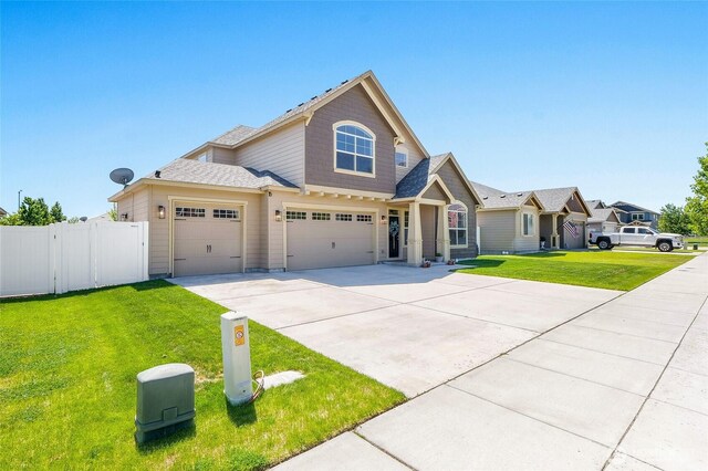 4709 W Fox St, Moses Lake, WA 98837 - view of front facade featuring driveway, an attached garage, and a garage