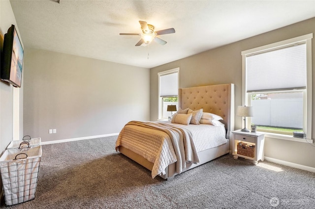 4709 W Fox St, Moses Lake, WA 98837 - bedroom with carpet floors, multiple windows, baseboards, and ceiling fan