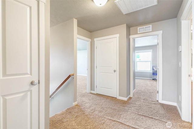 4709 W Fox St, Moses Lake, WA 98837 - hall featuring an upstairs landing, carpet, baseboards, and a textured ceiling