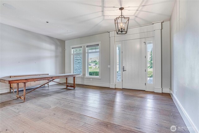 4942 Hurst Landing Rd, Rock Island, WA 98850 - foyer entrance with hardwood / wood-style flooring, a chandelier, and baseboards
