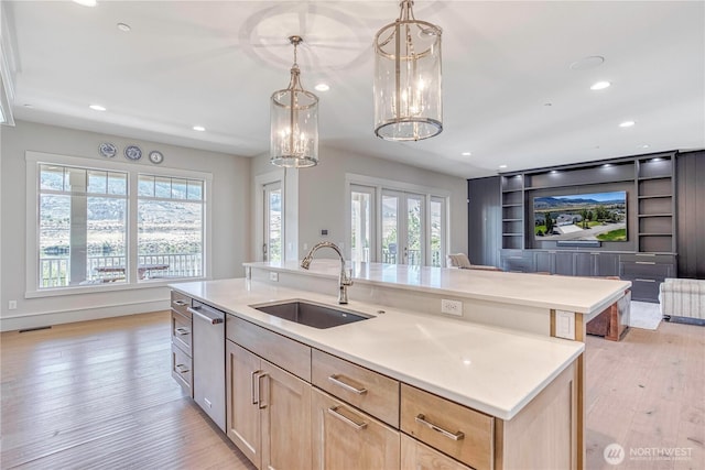 4942 Hurst Landing Rd, Rock Island, WA 98850 - kitchen with a sink, dishwasher, light wood-style floors, recessed lighting, and light countertops