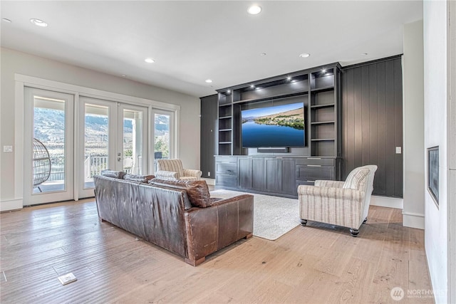 4942 Hurst Landing Rd, Rock Island, WA 98850 - living area featuring light wood finished floors, built in features, recessed lighting, french doors, and baseboards