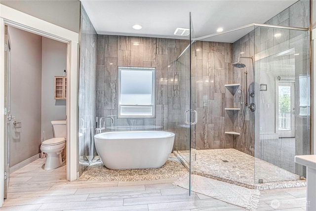 4942 Hurst Landing Rd, Rock Island, WA 98850 - bathroom featuring a freestanding tub, toilet, a shower stall, and recessed lighting