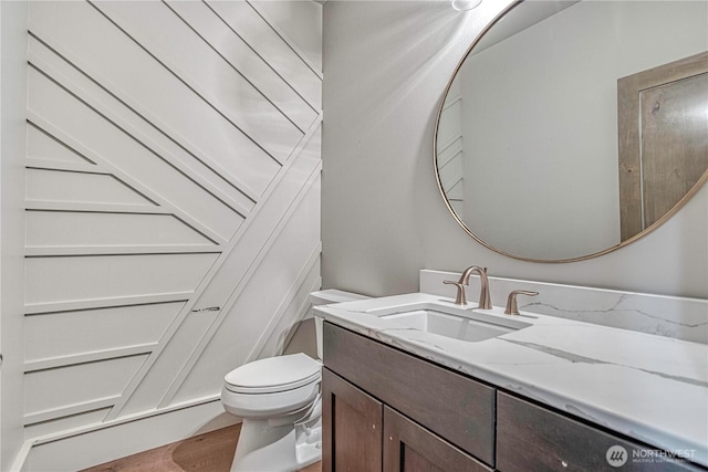 4942 Hurst Landing Rd, Rock Island, WA 98850 - half bath featuring vanity, toilet, and wood finished floors