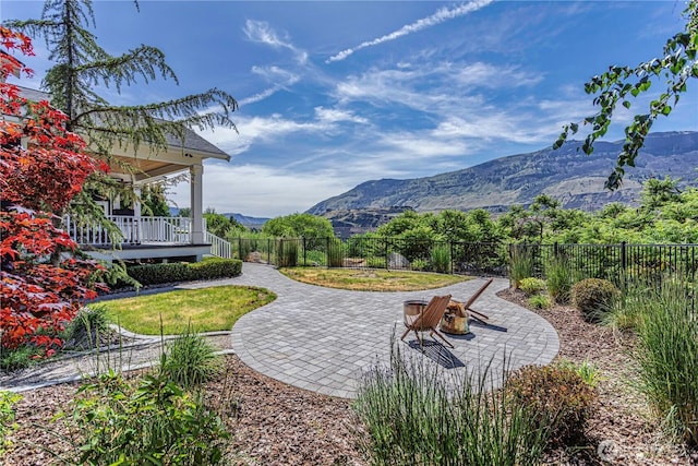 4942 Hurst Landing Rd, Rock Island, WA 98850 - fenced backyard with a mountain view and a patio