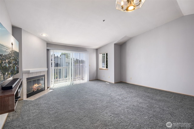 11325 19th Ave SE Unit C309, Everett, WA 98208 - unfurnished living room with a fireplace, carpet floors, vaulted ceiling, and a chandelier