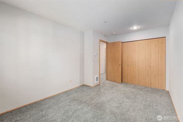 11325 19th Ave SE Unit C309, Everett, WA 98208 - unfurnished bedroom with carpet, baseboards, and a closet