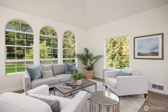 8021 NE Sandpiper Ln, Bainbridge Island, WA 98110 - living area with baseboards and wood finished floors