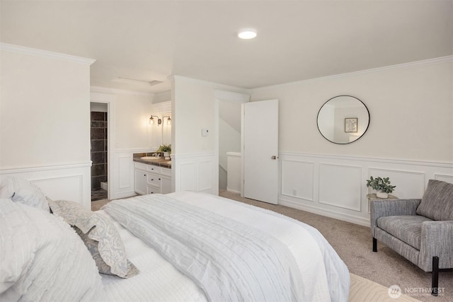 8021 NE Sandpiper Ln, Bainbridge Island, WA 98110 - bedroom with a decorative wall, crown molding, wainscoting, light colored carpet, and a sink