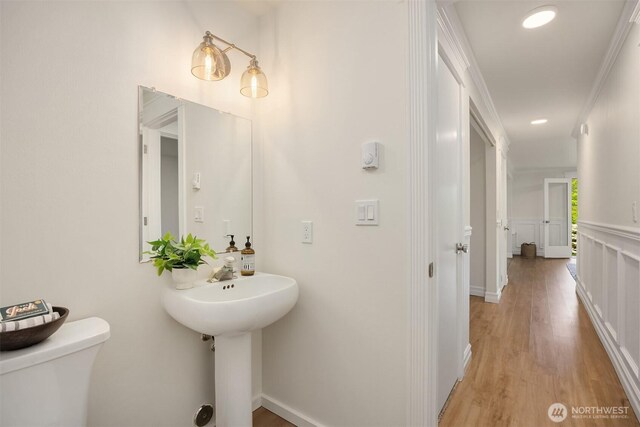 8021 NE Sandpiper Ln, Bainbridge Island, WA 98110 - bathroom with toilet and wood finished floors