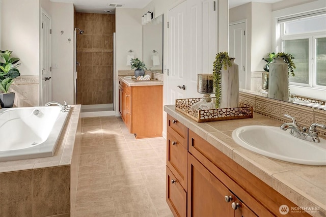 412 15th Ave, Kirkland, WA 98033 - full bathroom with vanity, a stall shower, a bath, and tile patterned flooring