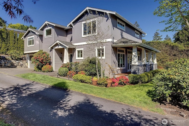 412 15th Ave, Kirkland, WA 98033 - craftsman-style house with an attached garage, a front lawn, and driveway