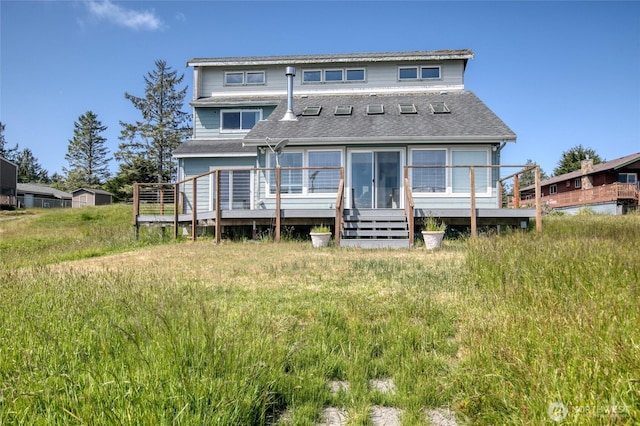 580 Mt Olympus Ave SE, Ocean Shores, WA 98569 - back of house with a deck and roof with shingles