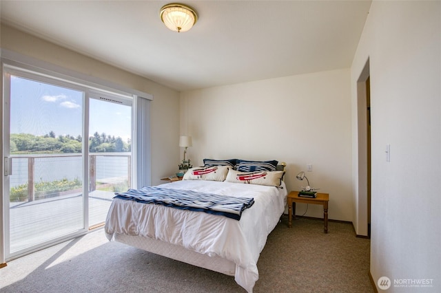 580 Mt Olympus Ave SE, Ocean Shores, WA 98569 - carpeted bedroom with multiple windows and access to exterior