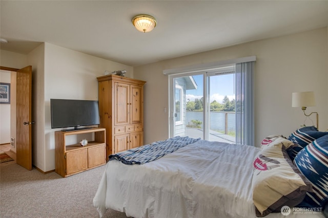 580 Mt Olympus Ave SE, Ocean Shores, WA 98569 - bedroom with light colored carpet and access to exterior