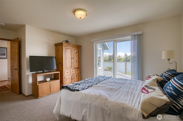580 Mt Olympus Ave SE, Ocean Shores, WA 98569 - bedroom featuring light carpet and access to outside