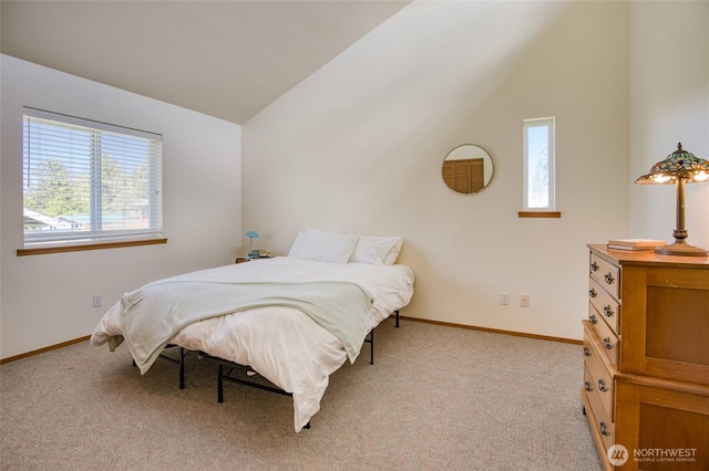 580 Mt Olympus Ave SE, Ocean Shores, WA 98569 - carpeted bedroom featuring multiple windows, vaulted ceiling, and baseboards