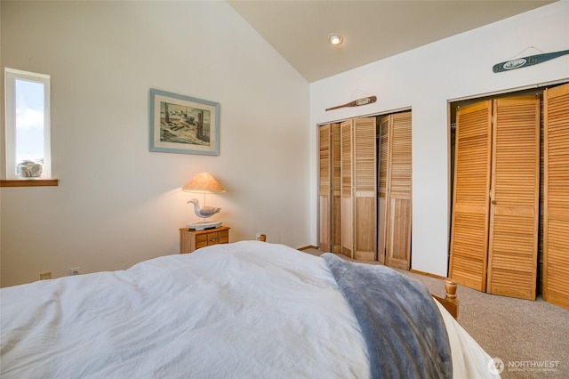 580 Mt Olympus Ave SE, Ocean Shores, WA 98569 - carpeted bedroom with two closets, lofted ceiling, and recessed lighting