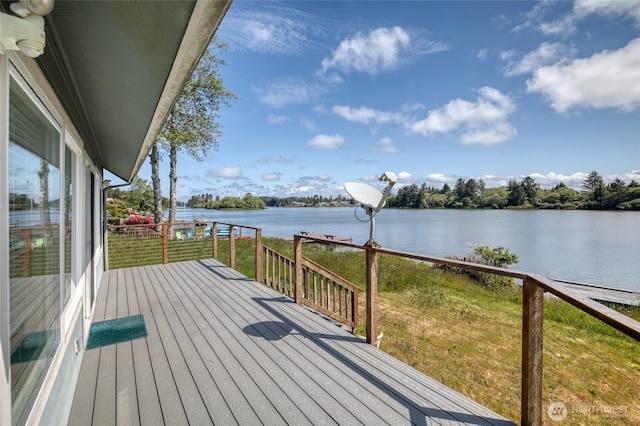 580 Mt Olympus Ave SE, Ocean Shores, WA 98569 - wooden terrace with a water view and a lawn