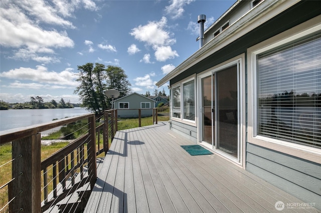 580 Mt Olympus Ave SE, Ocean Shores, WA 98569 - wooden deck with a water view