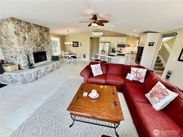 530 Sand Dune Ave SW, Ocean Shores, WA 98569 - living room featuring lofted ceiling, a ceiling fan, a fireplace, and stairs