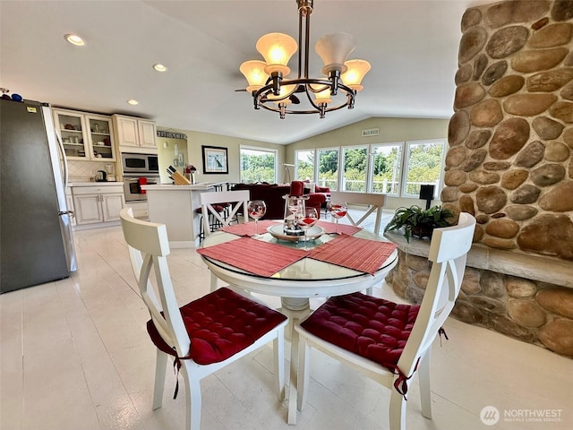 530 Sand Dune Ave SW, Ocean Shores, WA 98569 - dining space with a chandelier, lofted ceiling, and recessed lighting