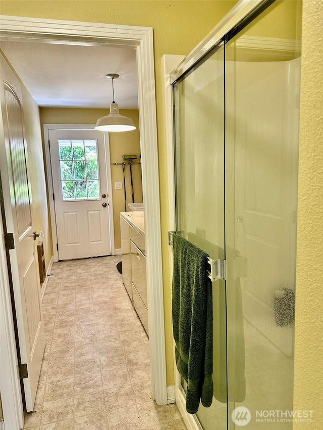 530 Sand Dune Ave SW, Ocean Shores, WA 98569 - bathroom with independent washer and dryer, a shower stall, and vanity