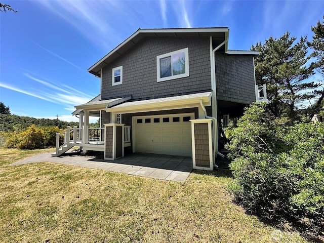 530 Sand Dune Ave SW, Ocean Shores, WA 98569 - view of home's exterior featuring a garage and a lawn