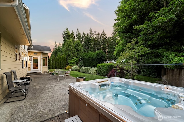 2616 171st Ave E, Lake Tapps, WA 98391 - pool at dusk with a hot tub and a patio area
