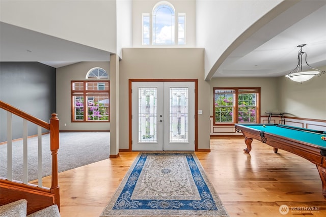 2616 171st Ave E, Lake Tapps, WA 98391 - entrance foyer with wood finished floors, arched walkways, french doors, baseboards, and stairway