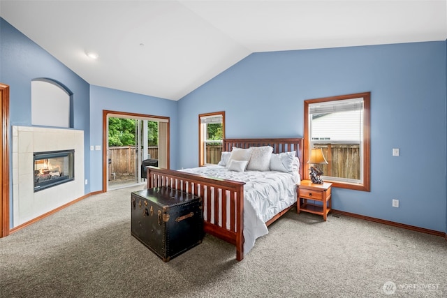 2616 171st Ave E, Lake Tapps, WA 98391 - bedroom featuring access to exterior, lofted ceiling, carpet floors, baseboards, and a fireplace