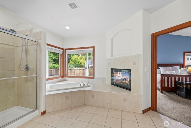 2616 171st Ave E, Lake Tapps, WA 98391 - full bathroom featuring connected bathroom, a bath, a shower stall, and tile patterned floors