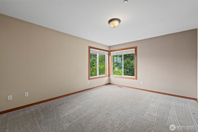 2616 171st Ave E, Lake Tapps, WA 98391 - empty room featuring baseboards and carpet flooring