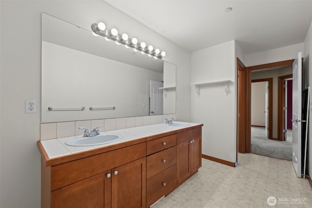 2616 171st Ave E, Lake Tapps, WA 98391 - bathroom with double vanity, tile patterned floors, and baseboards