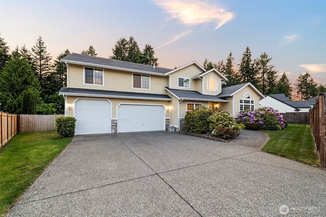 2616 171st Ave E, Lake Tapps, WA 98391 - traditional-style home featuring concrete driveway, an attached garage, and stone siding