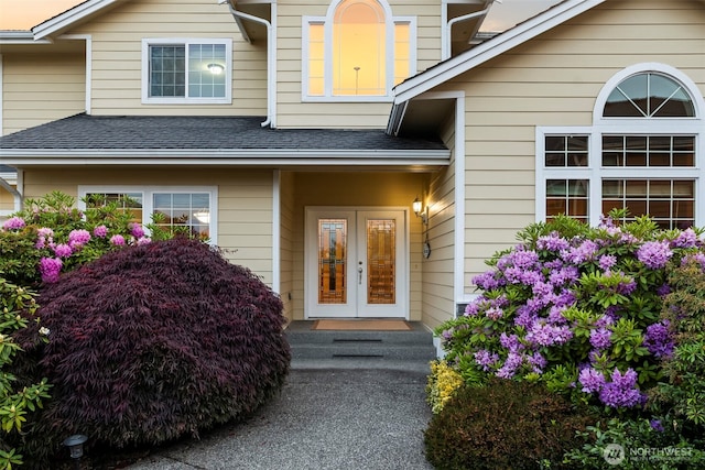 2616 171st Ave E, Lake Tapps, WA 98391 - view of exterior entry with french doors and roof with shingles