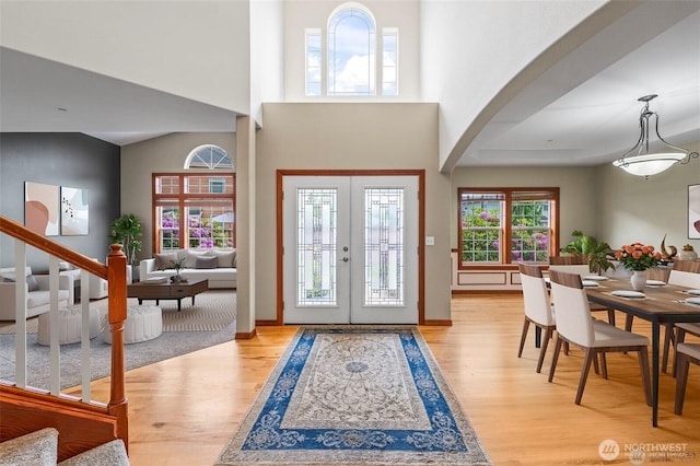 2616 171st Ave E, Lake Tapps, WA 98391 - entrance foyer with wood finished floors, arched walkways, french doors, stairs, and a towering ceiling