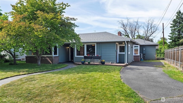 1109 University St, Walla Walla, WA 99362 - view of front of home featuring a chimney and roof with shingles