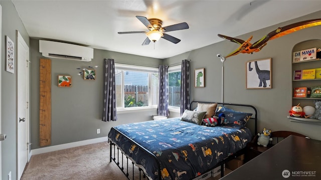1109 University St, Walla Walla, WA 99362 - carpeted bedroom with a wall mounted air conditioner, baseboards, and a ceiling fan