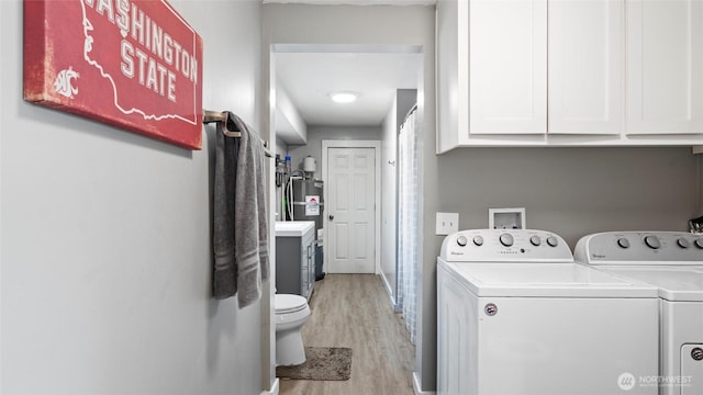 1109 University St, Walla Walla, WA 99362 - laundry area featuring washer and dryer and light wood-style floors