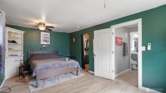 1109 University St, Walla Walla, WA 99362 - bedroom with light wood-style flooring, baseboards, connected bathroom, and ceiling fan