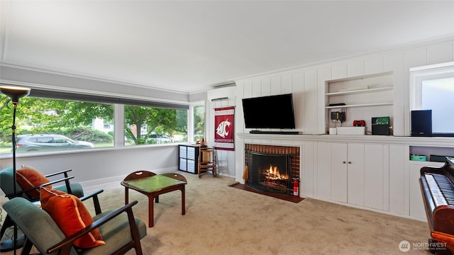 1109 University St, Walla Walla, WA 99362 - living room featuring light carpet, a fireplace, ornamental molding, a wall mounted AC, and built in shelves